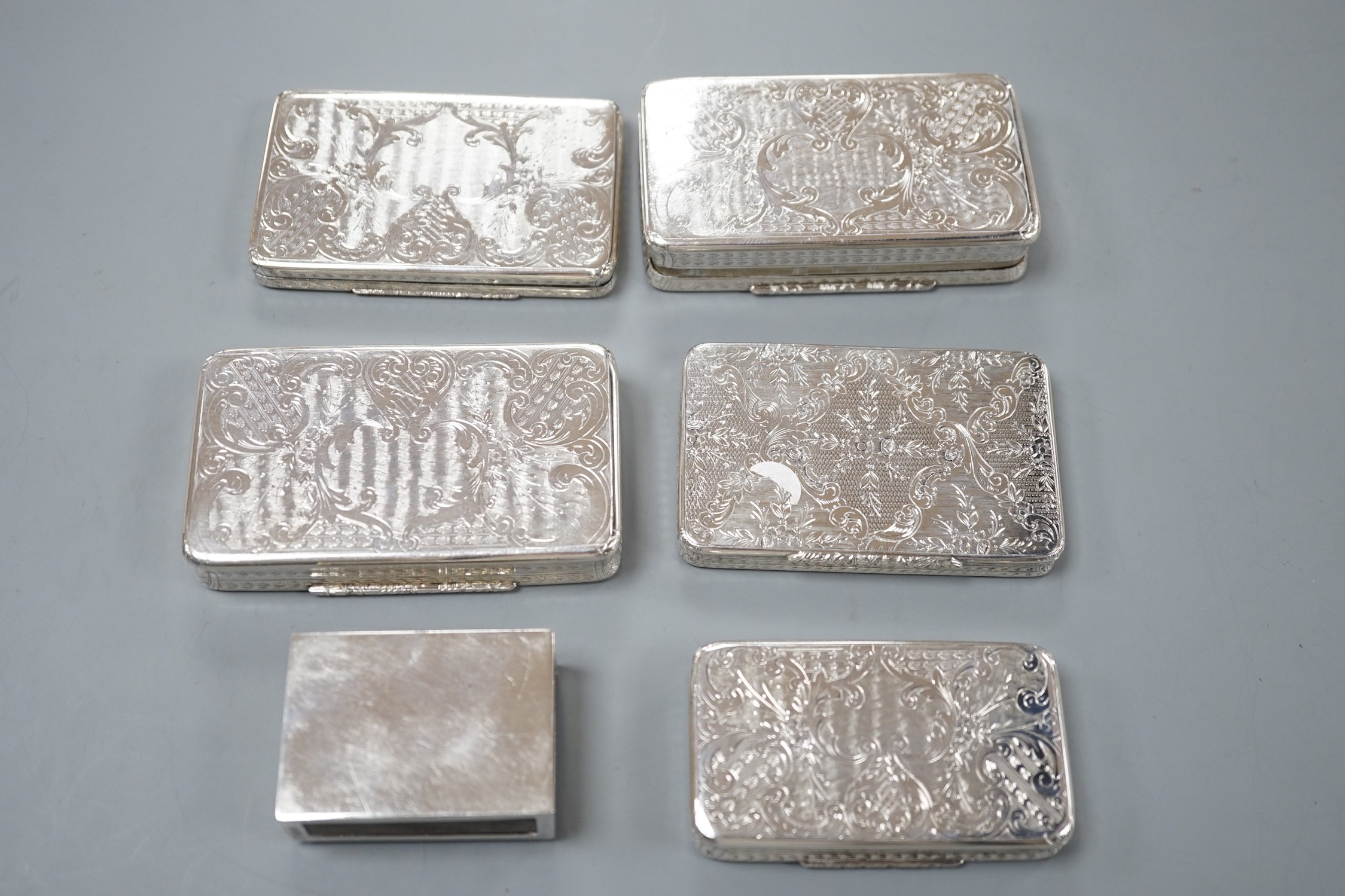 Five similar 20th century Spanish engraved white metal rectangular pill boxes, of varying sizes, largest 92mm and a 925 matchbox sleeve.